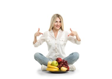 Happy young woman and healthy vegetarian food, fruit. Concept of clipart