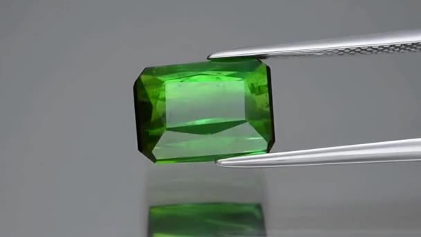 Natural Green Tourmaline Gray Background — Stock Video