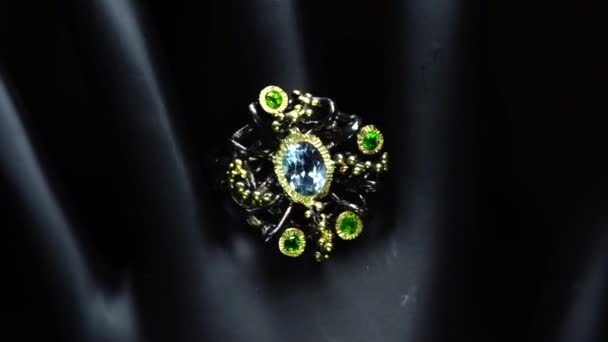 Silver ring with natural gemstones on the black hand — Stock Video