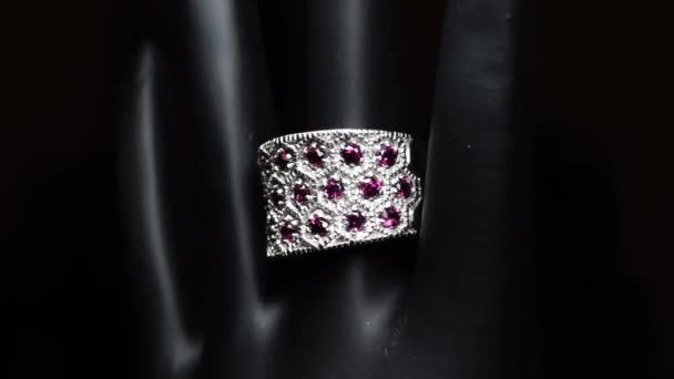 Silver ring with natural gemstones on the black hand — Stock Video