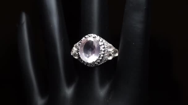 Silver ring with natural gemstones on the black hand — Stock Video