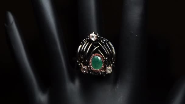 Silver ring with natural gemstones on the black hand — Stock Video