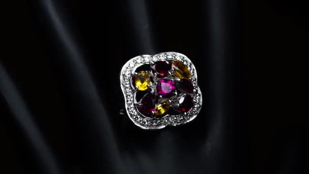 Silver ring with natural gemstones on the black hand — Stock Video