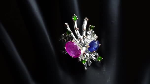 Silver ring with natural gemstones on the black hand — Stock Video