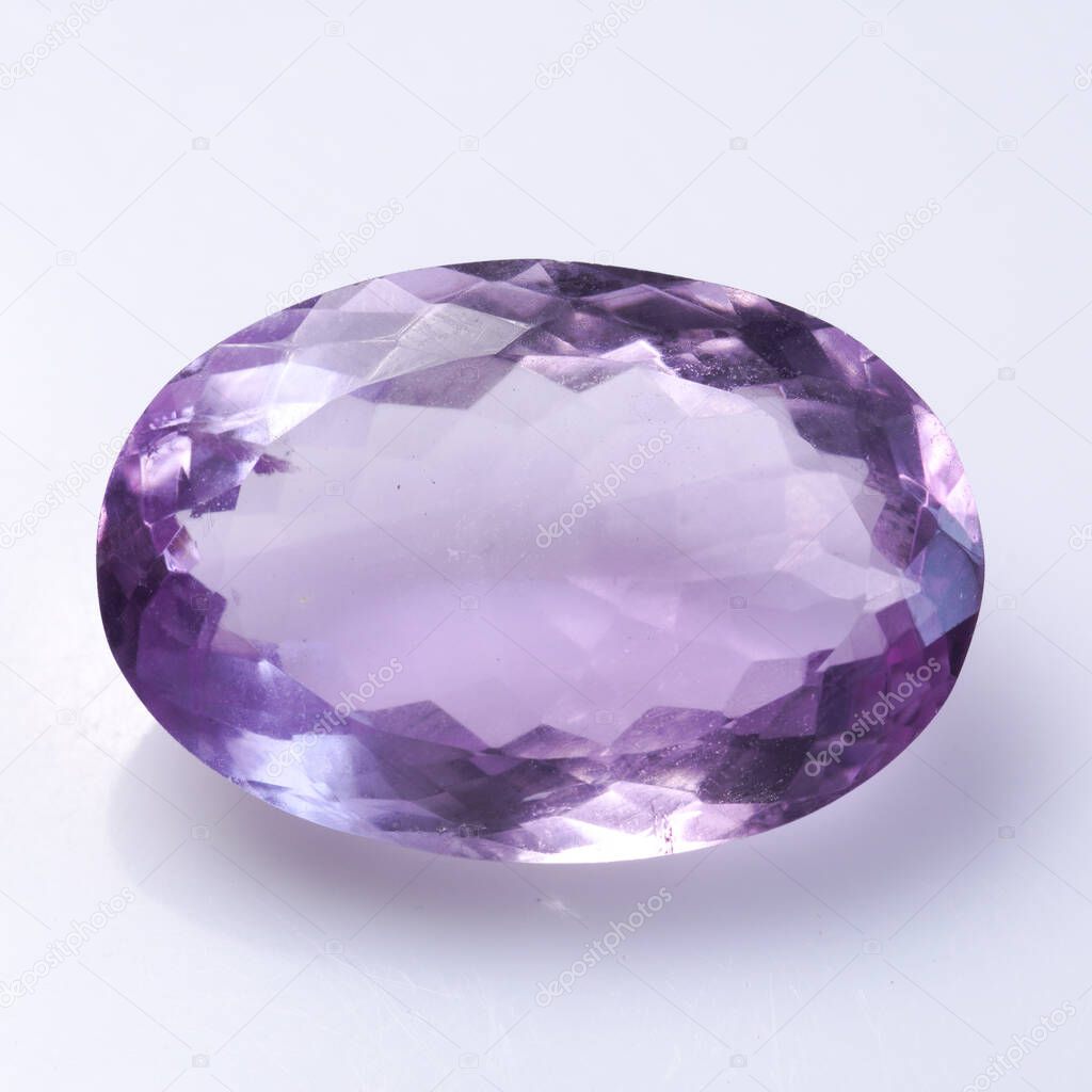 Natural stone purple amethyst on a white background
