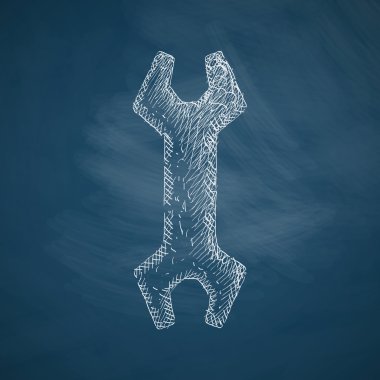 wrench icon hand drawn on chalkboard