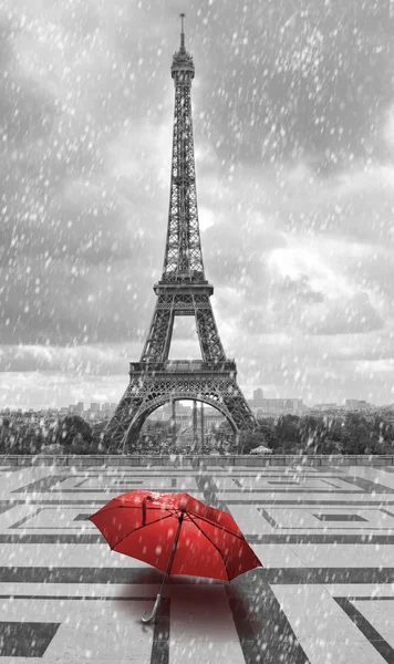 Eiffel tower in the rain. Black and white photo with red element — Stock Photo, Image