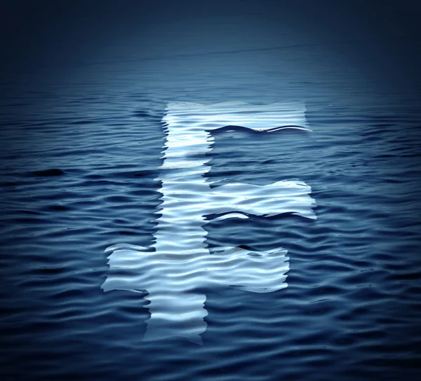 Swiss franc  symbol drifts on the water.Economic crisis concept. — Stock Photo, Image