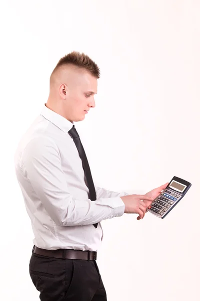 Businessman working with a calculator against a white background — Stock Photo, Image