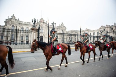 Changing of the Guard at Government Palace known as House of Pizarro, at Plaza de Armas in Lima, Peru clipart