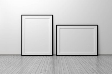 Ahşap zeminde duvarın yanında duran ince siyah çerçeve kenarlı iki dikey ve yatay A4 şablonu. 3d illüstrasyon.
