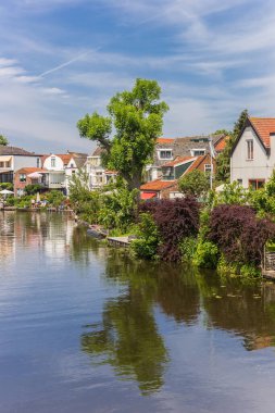 Houses at the river Vlist in Haastrecht, Netherlands clipart