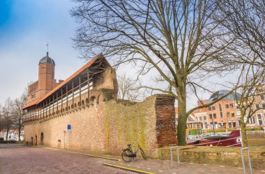 Historic city wall and Pelsertoren tower in Zwolle, Netherlands clipart
