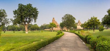Panorama of the garden and temples in Khajuraho, India clipart