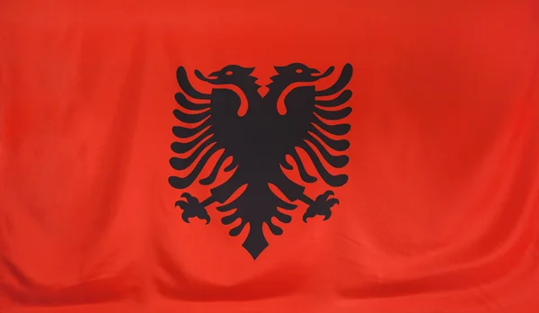 Arnavutluk bayrağı gerçek kumaş — Stok fotoğraf