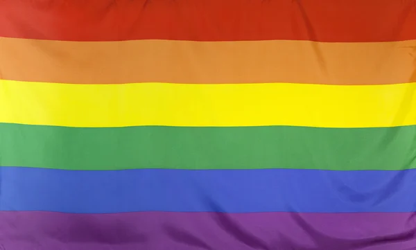 Bandera de arco iris tela real — Foto de Stock