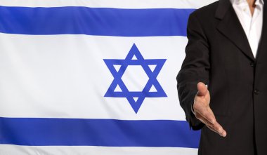 Open hand and Israel flag in the background clipart