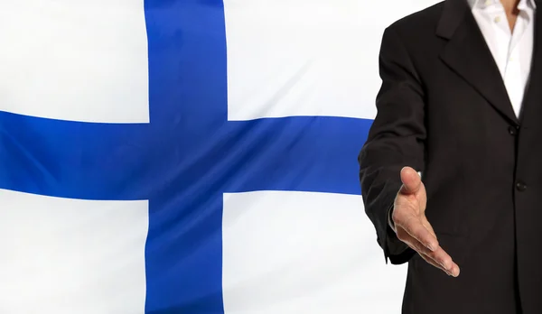 Mano abierta y bandera de Finlandia en el fondo — Foto de Stock