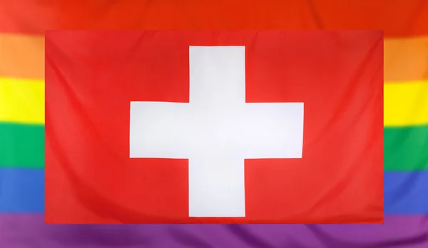 Vlag van Zwitserland en regenboog vlag — Stockfoto
