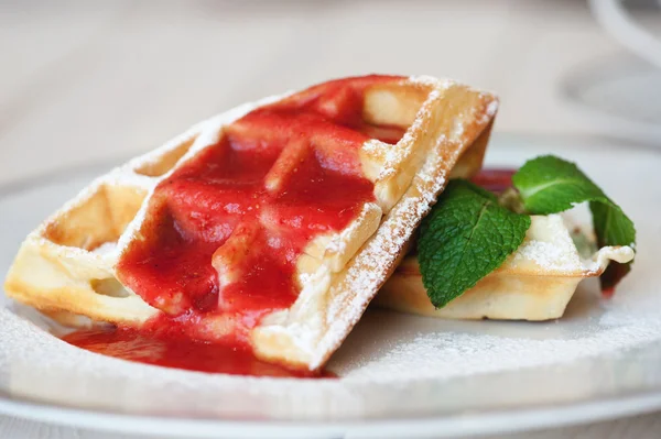 Belgian waffles with strawberry sauce — Stock Photo, Image