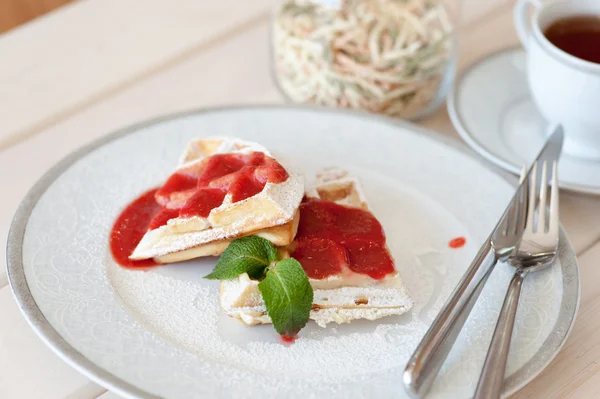 Belgian waffles with strawberry sauce — Stock Photo, Image