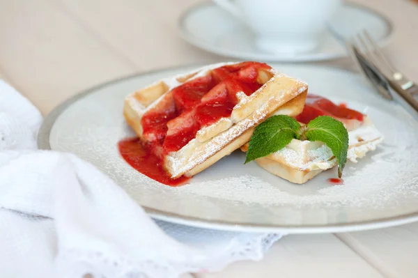 Belgian waffles with strawberry sauce — Stock Photo, Image