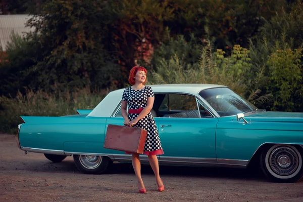 Retro girl and blue Cadillac — Stock Photo, Image