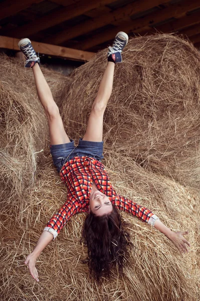 Attractive girl in hay — Stock Photo, Image