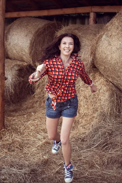 Attractive girl in hay — Stock Photo, Image