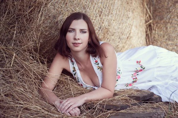 Attractive girl in hay — Stock Photo, Image