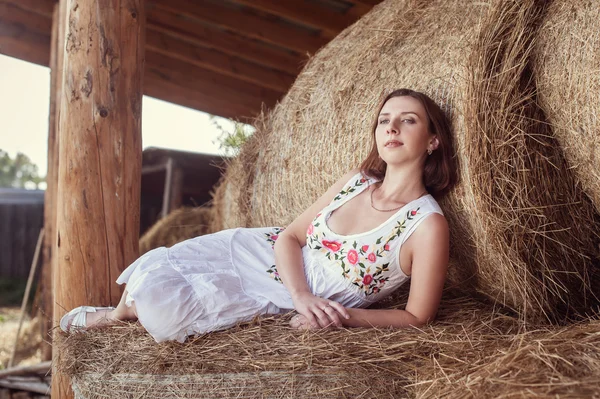 Attractive girl in hay — Stock Photo, Image