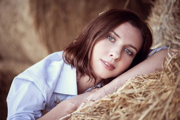 Attractive girl in hay — Stock Photo, Image