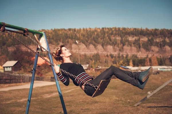 Happy woman on swing — Stock Photo, Image