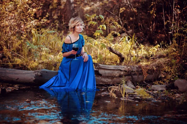 Woman in blue dress — Stock Photo, Image