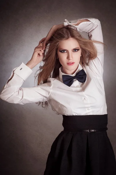 Blondie woman in white shirt and black bow-tie — Stock Photo, Image