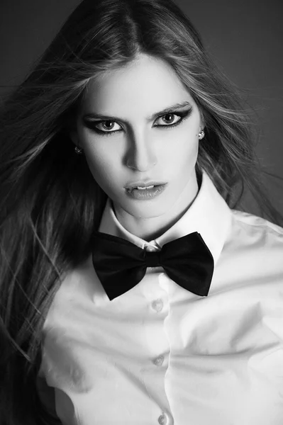 Blondie woman in white shirt and black bow-tie — Stock Photo, Image