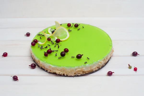 Cheesecake with green jelly — Stock Photo, Image