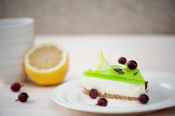 Cheesecake with green jelly — Stock Photo, Image