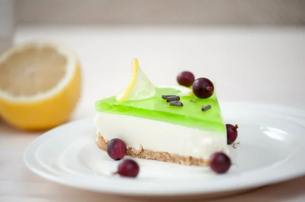 Cheesecake with green jelly — Stock Photo, Image