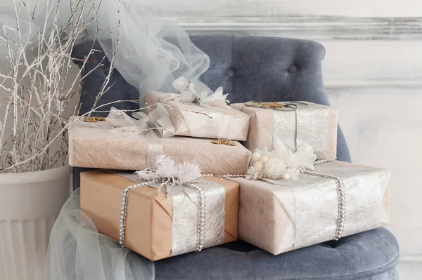 Wrapped gift boxes with ribbons as Christmas presents — Stock Photo, Image