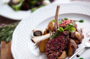 Rack of Lamb with mushrooms and roast potatoes clipart