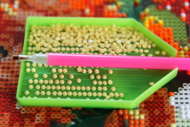Preparation of tools, acrylic rhinestones and pen, before starting work on 3D painting