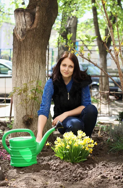 Young Brunette Girl Works Spring Garden Plants Flowers Pours Them — Stock Photo, Image