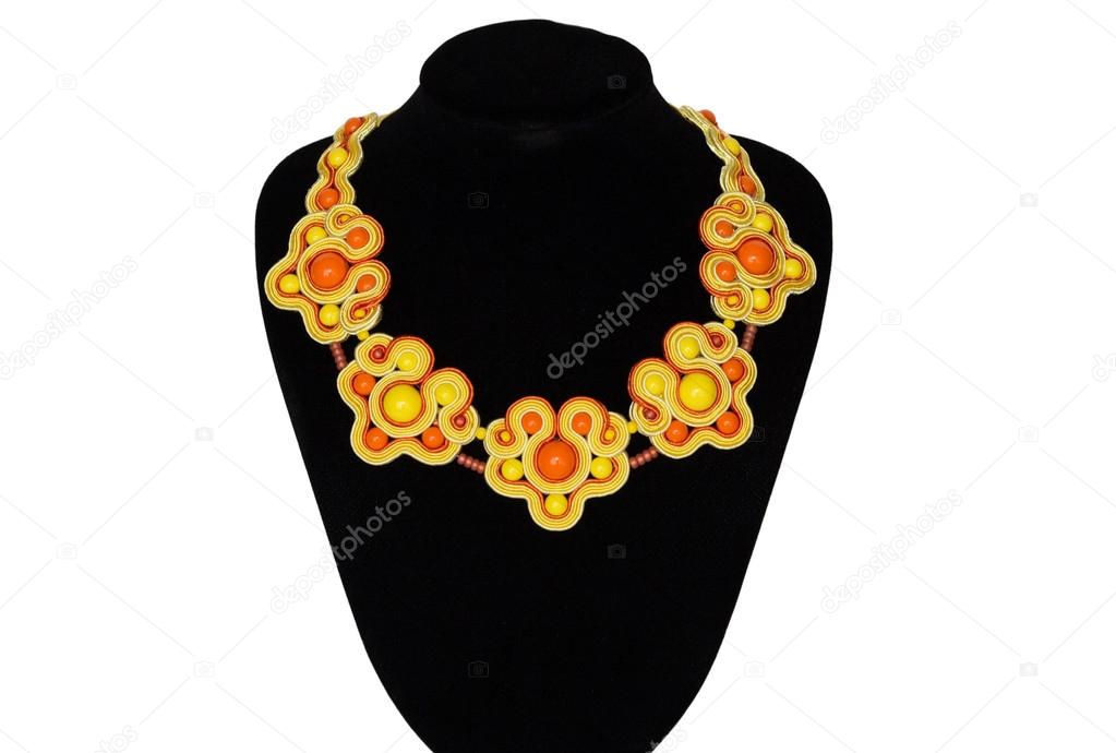 Yellow necklace on a rack