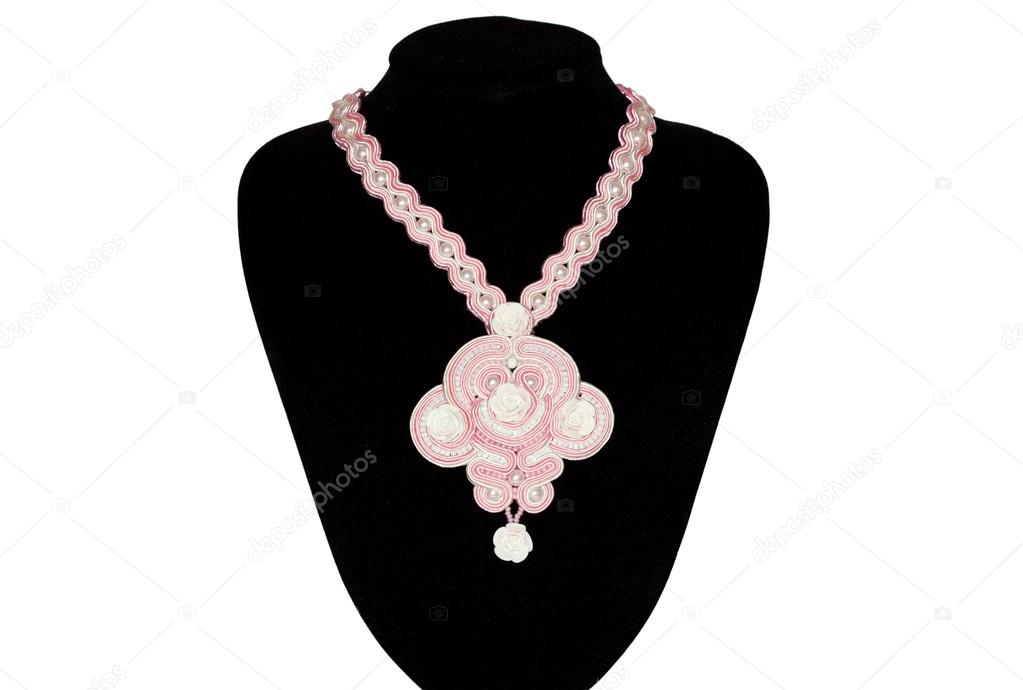 Pink necklace on a rack