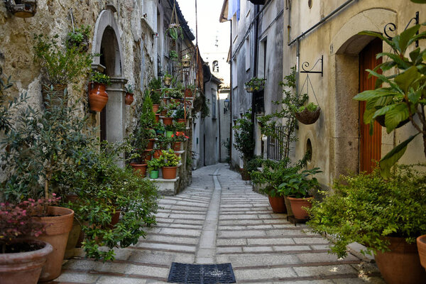 A narrow street between the old houses of Baselice, an old town in the province of Benevento, Italy.