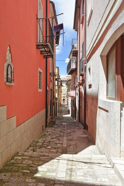 A narrow street between the old houses of Frosolone, a mountain village in the province of Isernia, Italy.