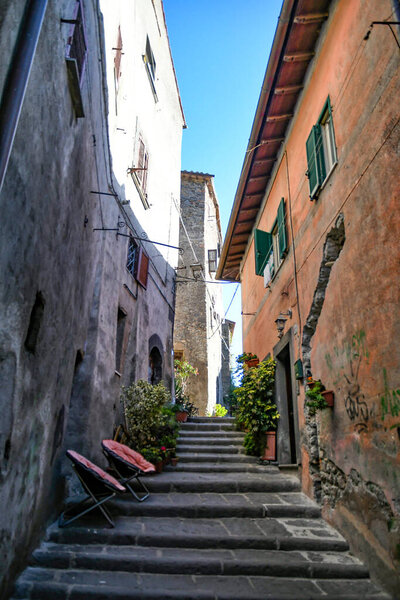 A narrow street in Bracciano, an old town in Lazio region, Italy.