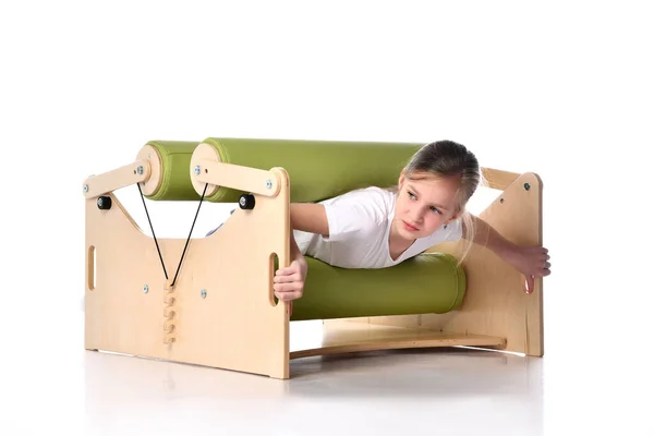 Smiling little child demonstrating usage of exercise set for persons with locomotor disorder, isolated on white, copy space — Stock Image Smiling little child demonstrating usage of exercise set for persons with locomotor disorder, isolated on white, copy space Stock Picture