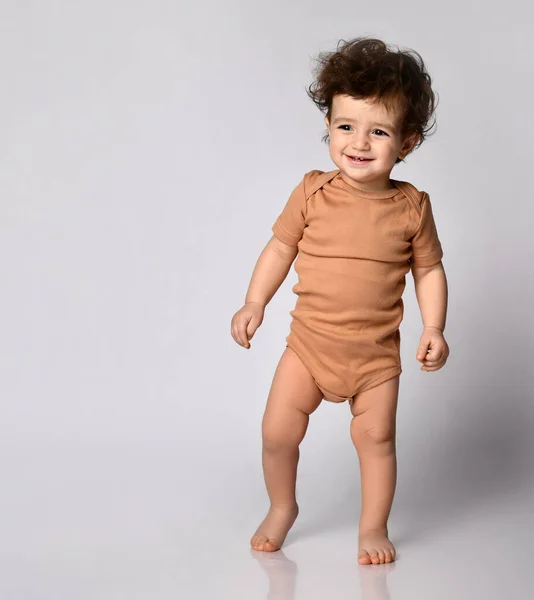 Child Learns Walk Cute Smiling Little Curly Haired Boy Standing — Stock Photo, Image